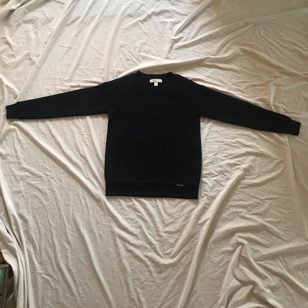 Black sweatshirt with a honeycomb dotty pattern